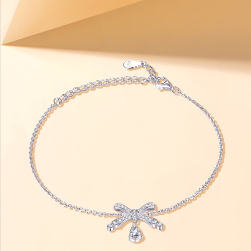 Pearlette - Pulseira com motivo de laço, moissanite em forma de pera e cravação em pavé