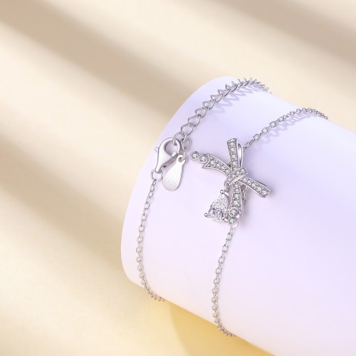 Pearlette - Pulseira com motivo de laço, moissanite em forma de pera e cravação em pavé