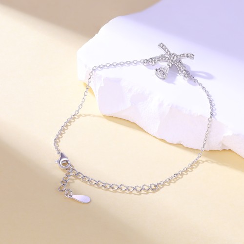 Pearlette - Pulseira com motivo de laço, moissanite em forma de pera e cravação em pavé